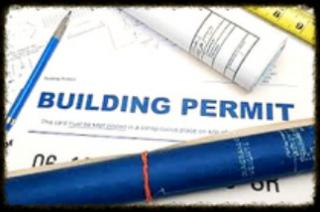 Building permit application with blueprint